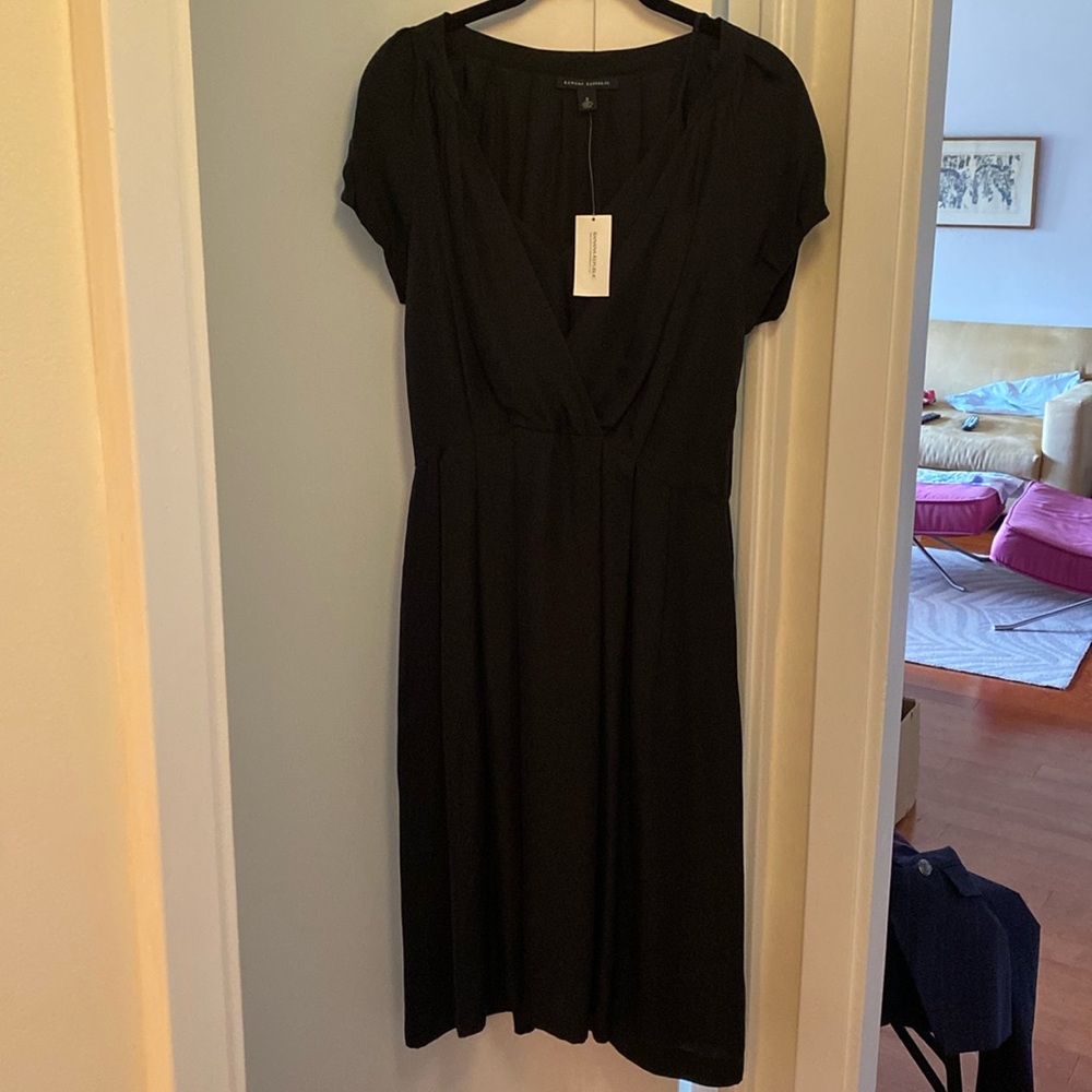 Silk dress with slip lining navy size 8 short cap sleeveless midi length